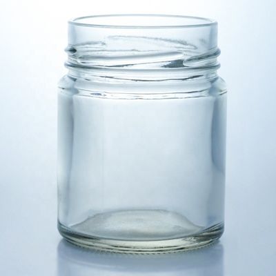 Bouteille de miel en verre ronde de 500 ml à bouche large personnalisée avec un bouchon métallique et un matériau de base en verre