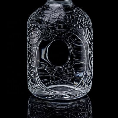 Bouteille en verre ronde sculptée 700 ml 750 ml Vodka Bouteille en verre Bouteille de vin avec type d'étanchéité en liège