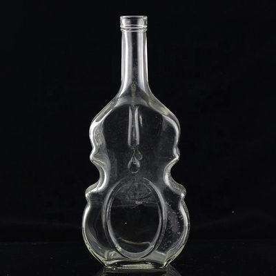 Bouteilles en verre en forme de guitare de 700 ml avec bouchon de liège pour le whisky de vodka clair ou personnalisé