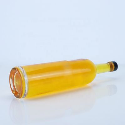 Logo personnalisé 700ml 750ml Bouteille en verre de forme ronde à haute pierre avec finition supérieure à vis
