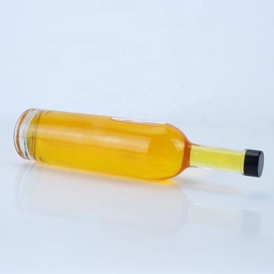 Logo personnalisé 700ml 750ml Bouteille en verre de forme ronde à haute pierre avec finition supérieure à vis