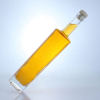 Bouteille en verre de liqueur en forme ronde de 700 ml avec logo personnalisé et finition en liège