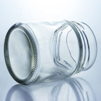 Bouteille de miel en verre ronde de 500 ml à bouche large personnalisée avec un bouchon métallique et un matériau de base en verre