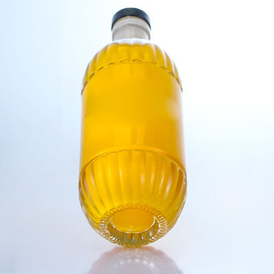 Bouteille en verre pour boissons industrielles avec dessin en relief et forme ronde de liège