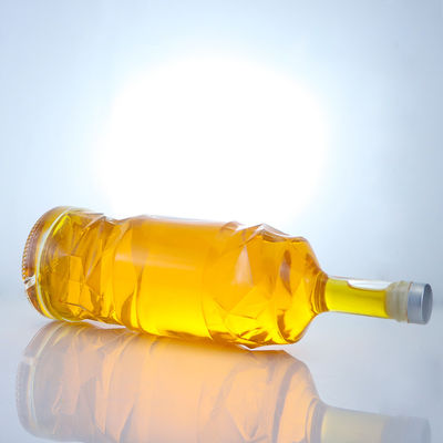 Bouteille en verre de liqueur avec logo personnalisable en relief et couleur de bouteille claire ou personnalisée