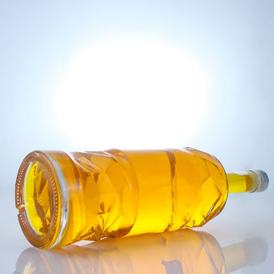 Bouteille en verre de liqueur avec logo personnalisable en relief et couleur de bouteille claire ou personnalisée