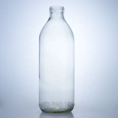 Bouteilles en verre transparentes de 1020 ml avec un bouchon à vis et une forme unique