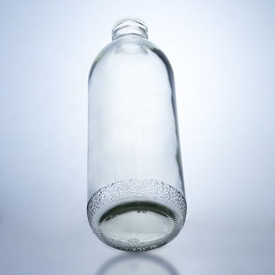 Bouteilles en verre transparentes de 1020 ml avec un bouchon à vis et une forme unique