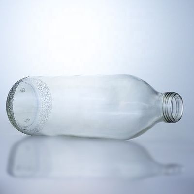 Bouteilles en verre transparentes de 1020 ml avec un bouchon à vis et une forme unique