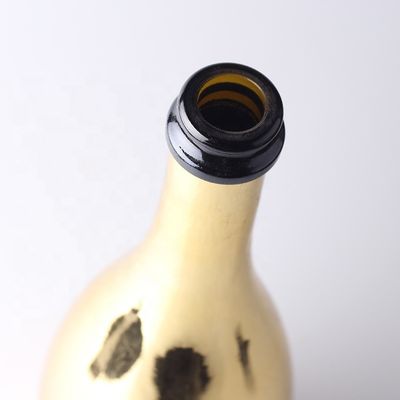 Bouteilles en verre de champagne en or sur mesure avec un bouchon en plastique pour le matériel du corps en verre