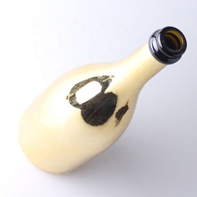 Bouteilles en verre de champagne en or sur mesure avec un bouchon en plastique pour le matériel du corps en verre