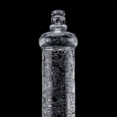 Belle bouteille en verre en relief de dragon avec couvercle en or Logo personnalisé et base en verre